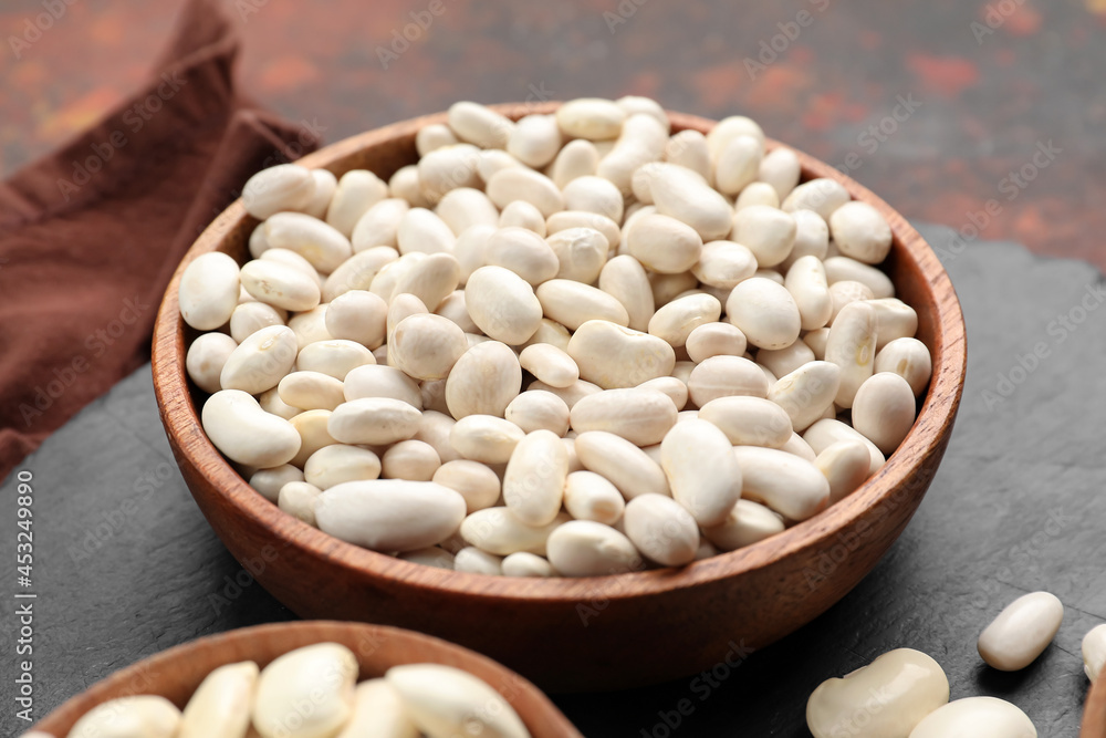 Bowls with raw beans on table, closeup Bowls with raw beans on table, closeup