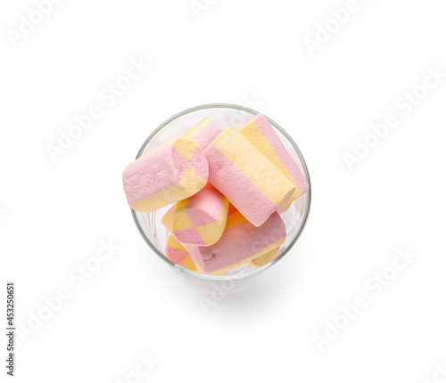 Glass with tasty marshmallows on white background