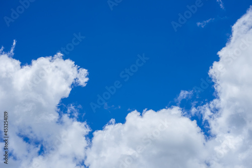many white clouds in the blue sky 