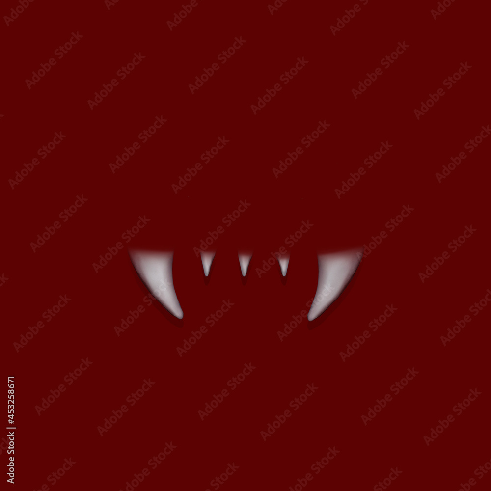 Vampire white teeth on the dark red background. Flat lay. Scary halloween teeth. Vampire white teeth on the dark red background. Flat lay. Scary halloween teeth.