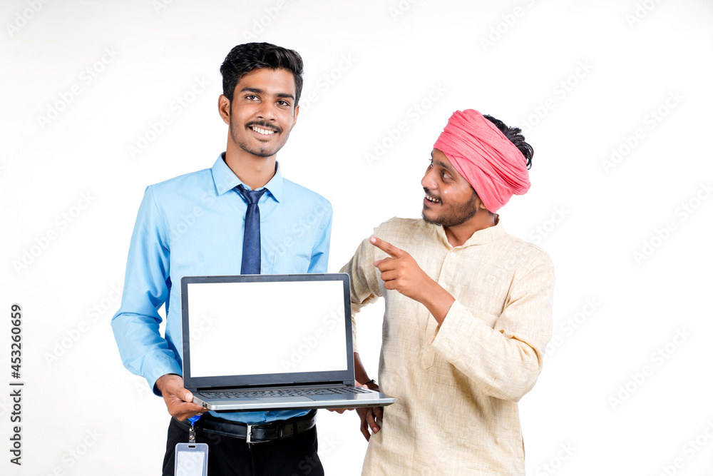 Young indian officer showing laptop screen with farmer on white background. Young indian officer showing laptop screen with farmer on white background.