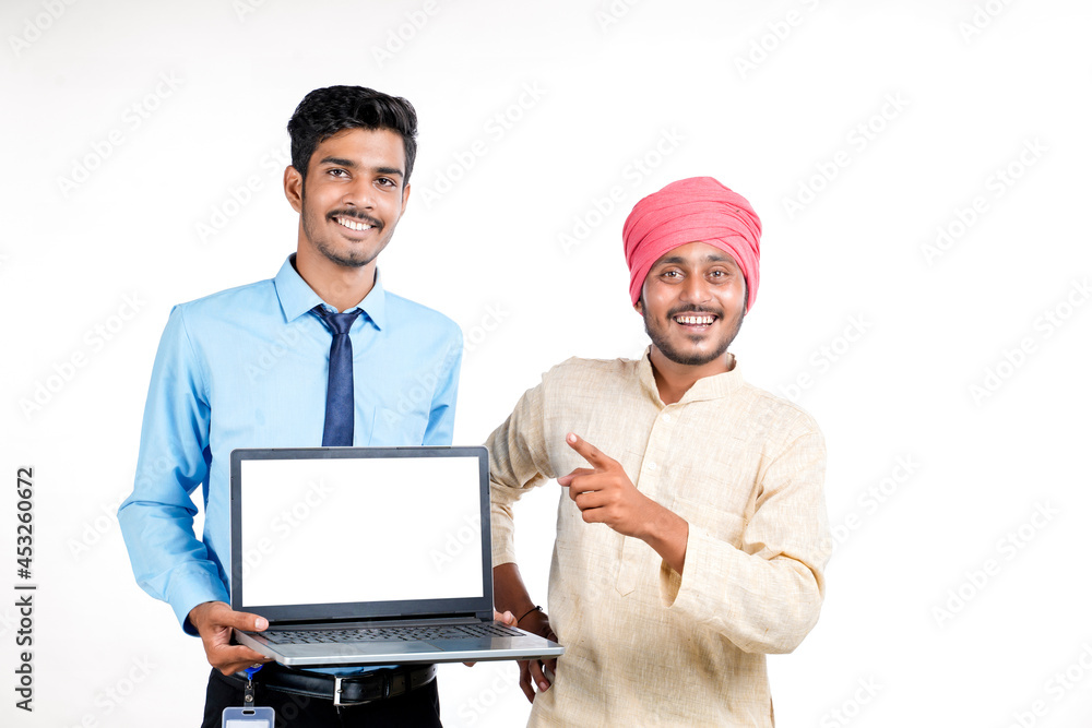 Young indian officer showing laptop screen with farmer on white background. Young indian officer showing laptop screen with farmer on white background.