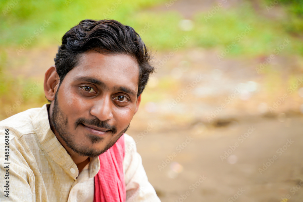 Young indian farmer giving face expression Young indian farmer giving face expression