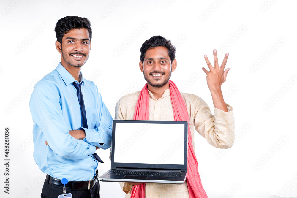 Young indian officer showing laptop screen with farmer on white background. Young indian officer showing laptop screen with farmer on white background.