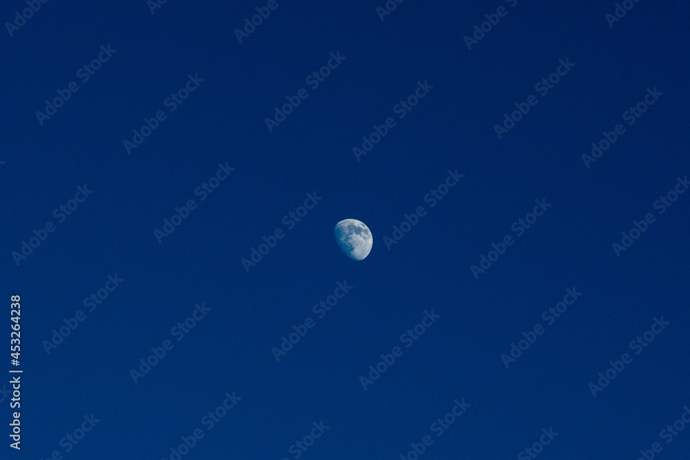 photo of the moon in the sky photo of the moon in the sky
