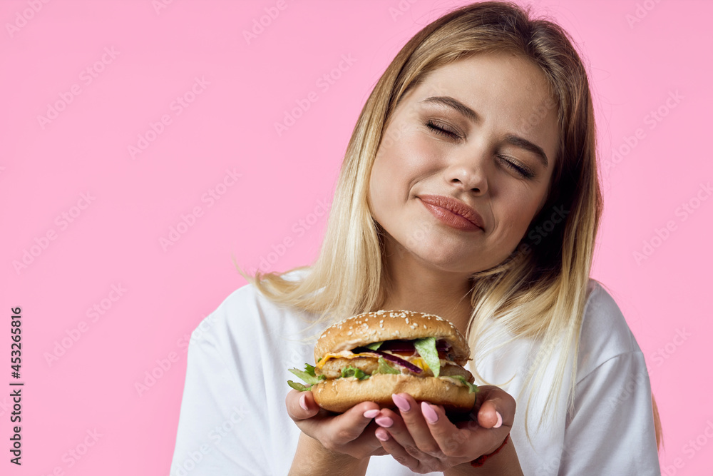 woman in white t-shirt hamburger snack delicious food restaurant woman in white t-shirt hamburger snack delicious food restaurant