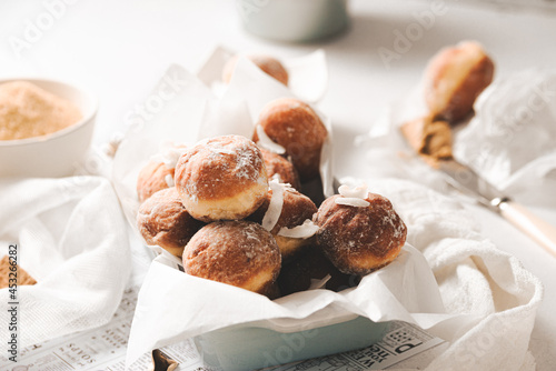 Mini donuts with powder sugar and coconut