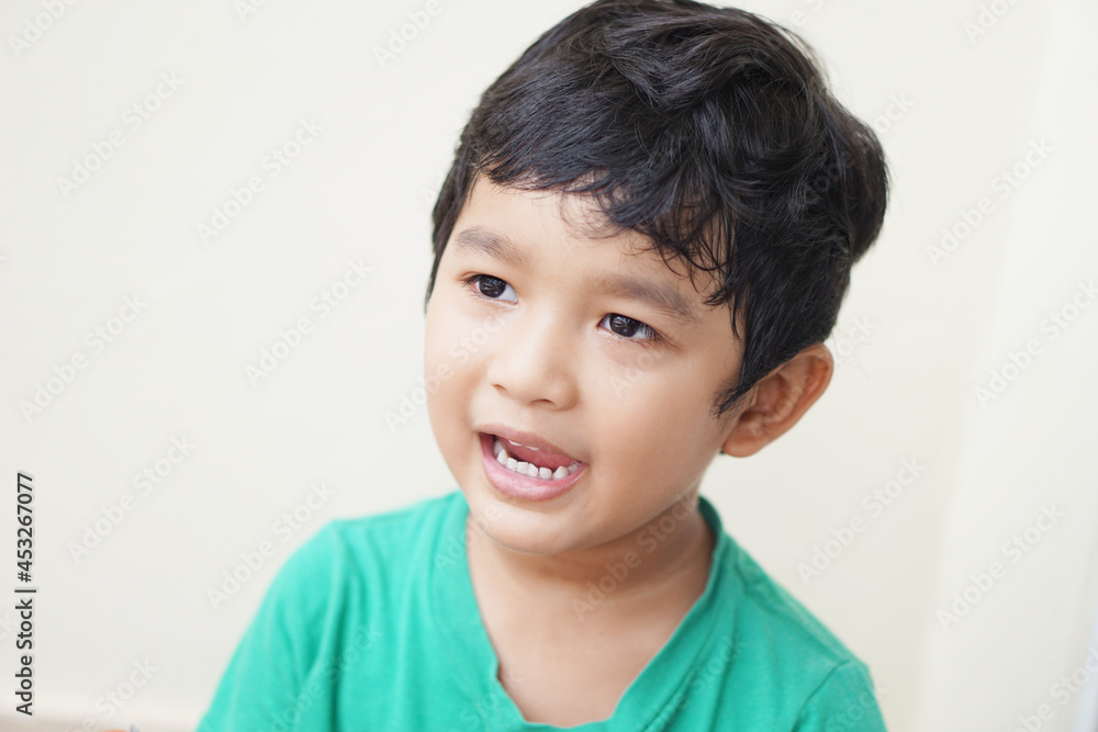 Cute Asian child little Thai boy 4 year old smile make a happy face concept. Cute Asian child little Thai boy 4 year old smile make a happy face concept.