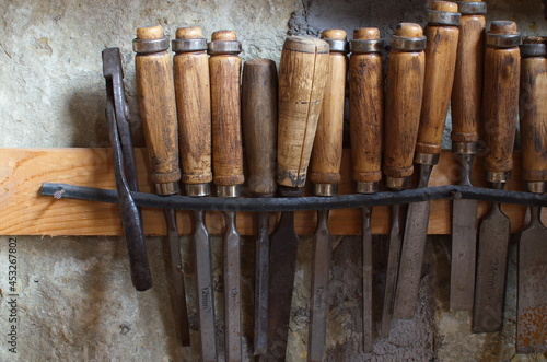 Carpentry tools, woodworking chisels, fixed to the wall