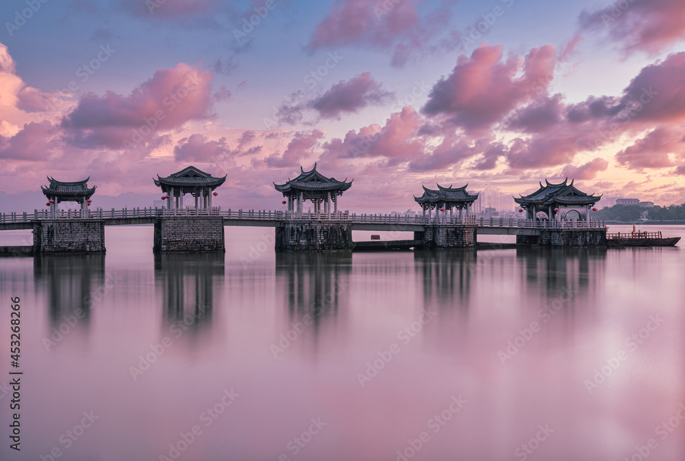 Fototapeta premium The famous ancient landmark, Guangji Bridge, in sunrise. The bridge locates at Chaozhou, Guangdong, China.