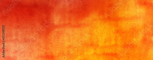 Horizontal yellow orange grunge texture cement or concrete wall banner, blank background wallpaper