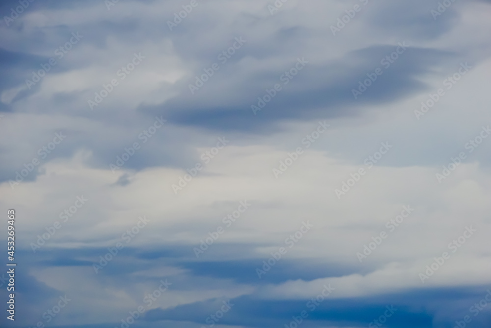 Navy sky background or backdrop with white clouds. Navy sky background or backdrop with white clouds.
