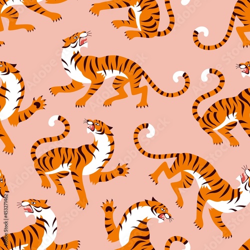 Asian Tigers modern pattern. Vector seamless pattern with a cartoon roaring tigers on pink background © nadzeya26