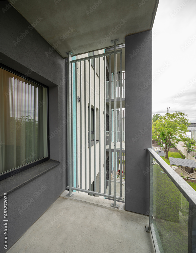 Fototapeta premium Balcony in luxury residential complex. Modern design. Metal partition.