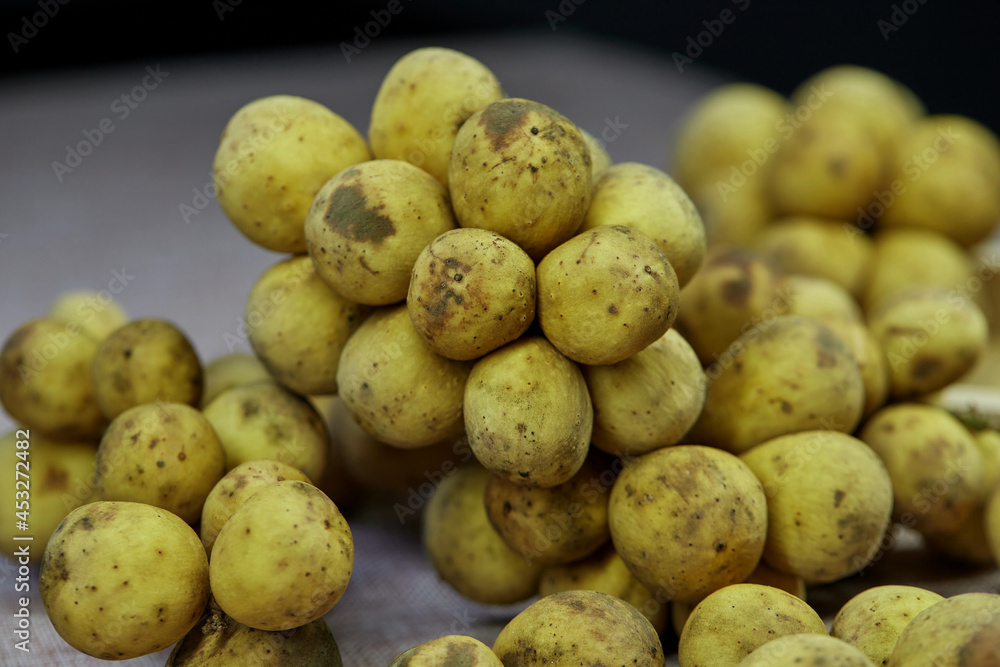 closeup bunch of ripe Longkong fruit on table closeup bunch of ripe Longkong fruit on table