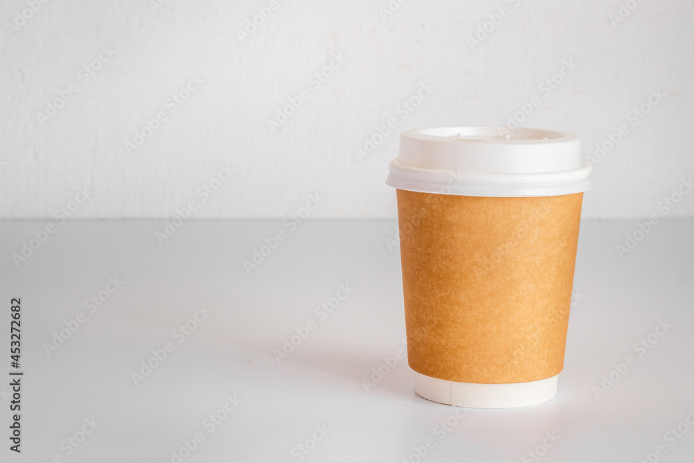 Take out coffee paper cup on the table. Close up Take out coffee paper cup on the table. Close up