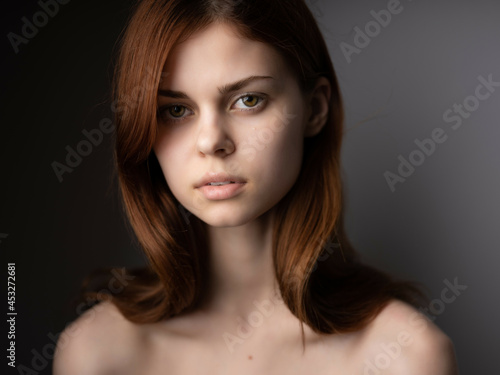 woman bare shoulders clear skin attractive look posing isolated background