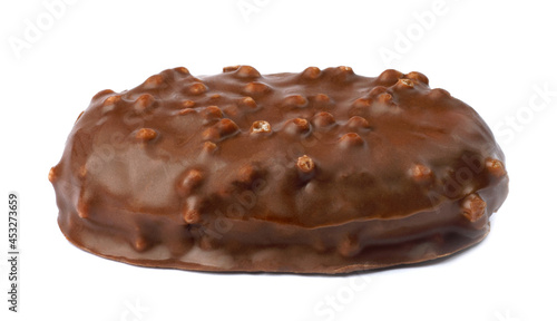 A large chocolate candy with air rice is isolated on a white background.