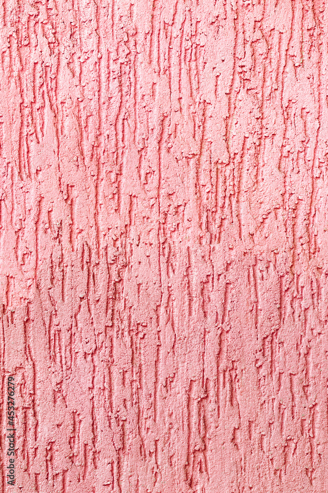 Textured surface coat plaster walls red color. Vertical photo. Textured surface coat plaster walls red color. Vertical photo.