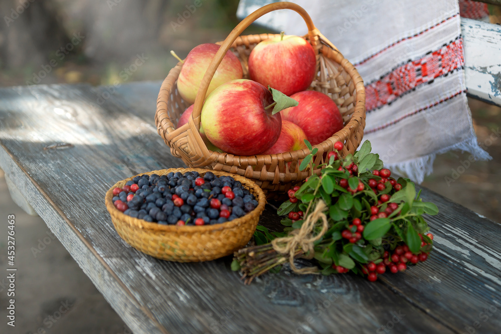 Still life with berries, apples and honey, a holiday at the end of summer, harvesting. Still life with berries, apples and honey, a holiday at the end of summer, harvesting.