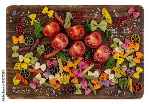 Ingredients on an old, dark, rustic, cracked, cutting board, on a white background. Italian food background. Cooking ingredients.