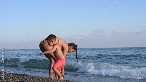 Mom on vacation with a child at the sea. 
