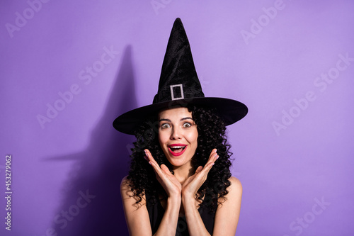 Portrait of young beautiful amazed smiling girl witch see big sale discount black friday isolated on violet color background