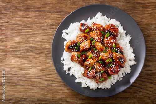 Plate of teriyaki chicken with rice, top view