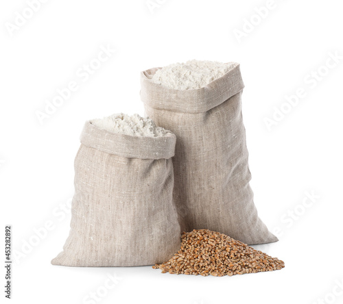 Sacks with flour and grains on white background
