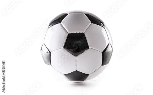 Classic black and white design of a soccer ball on an isolated white background