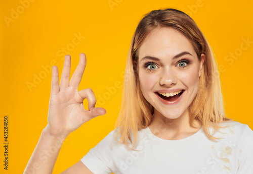 pretty woman in a white attractive look happy Lifestyle yellow background