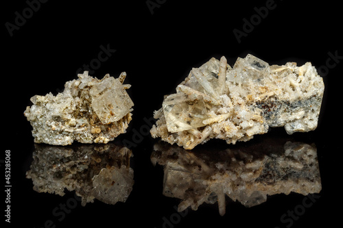 Macro mineral stone fluorite with quartz against black background