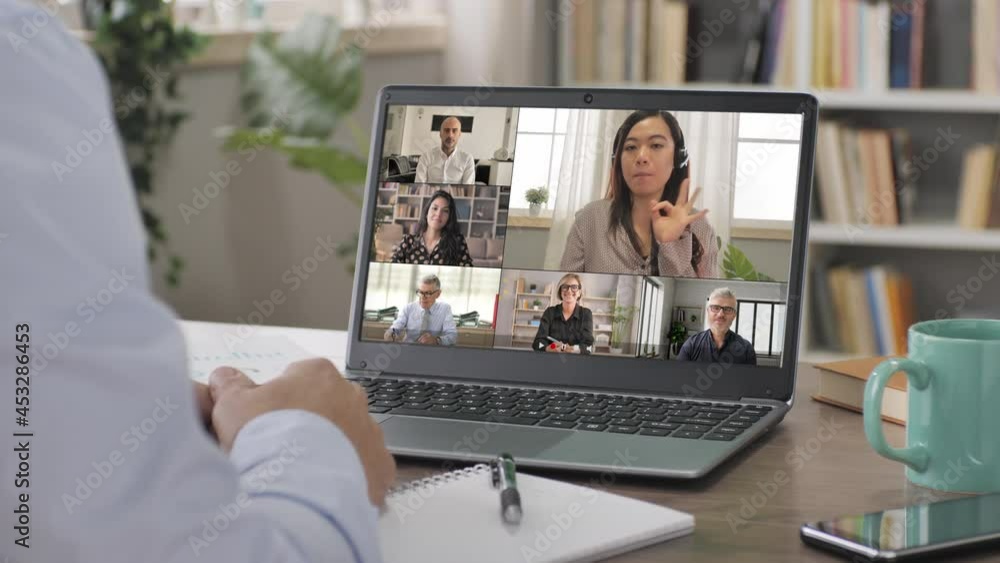 business man works from home in video conference call at the laptop