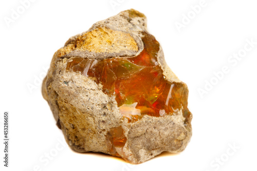 Macro Opal mineral stone in rock on white background