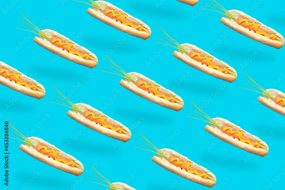Pattern carrots hot dog on blue background. Minimal concept.