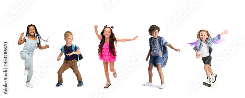 Horizontal collage made of portraits of little happy kids running isolated on white studio background. Human emotions  facial expression concept