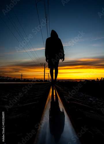 man, lines and night railway photo