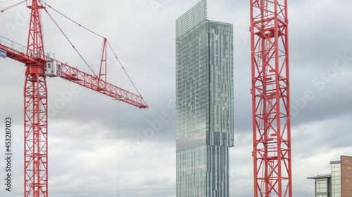 Manchester tower cranes with Beetham Tower in the background photo