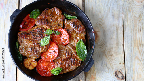 Grilled juicy steaks in a pan. Delicious meat.