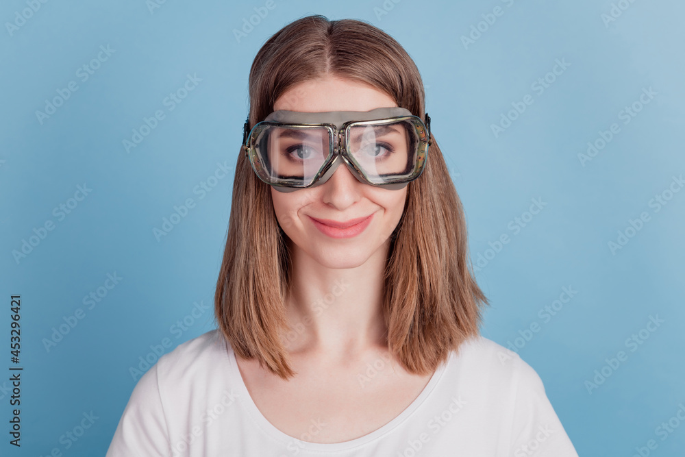 Portrait of charming cheerful snowboarder rider lady wear glasses on blue background