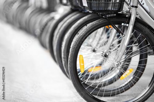 close up of bicycle wheel and tire along the lane for rental and ride vehicle for exercise, sport and transporation in local travel city photo