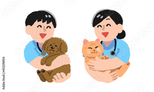 犬と猫を抱っこする獣医師男女