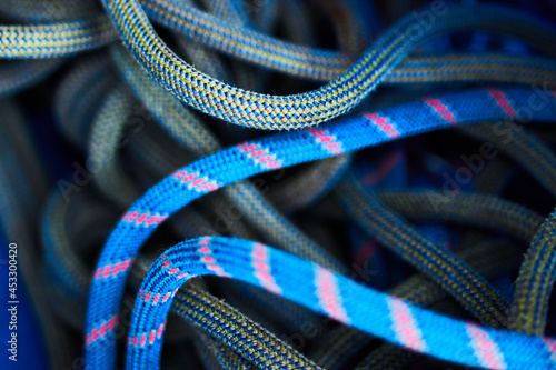 Pile of blue, red, yellow and green rock climbing rope