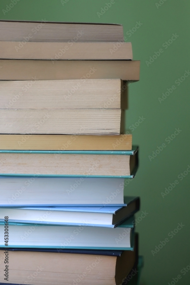 Stack of books with blue and green covers. Selective focus. Stack of books with blue and green covers. Selective focus.