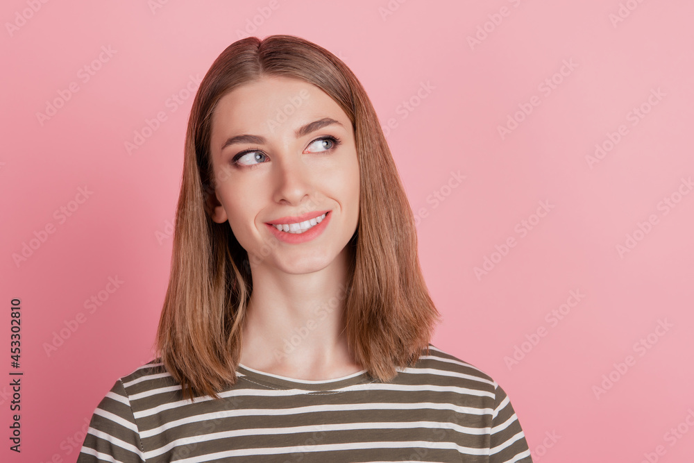 Portrait of dreamy playful lady look up blank space beaming smile on pink background Portrait of dreamy playful lady look up blank space beaming smile on pink background