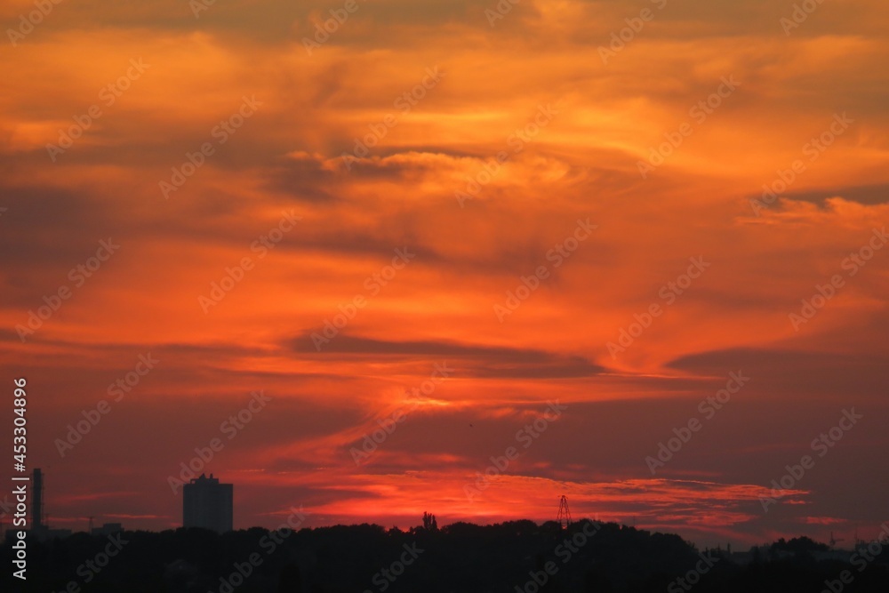 Beautiful fiery orange sunset over the city, natural background