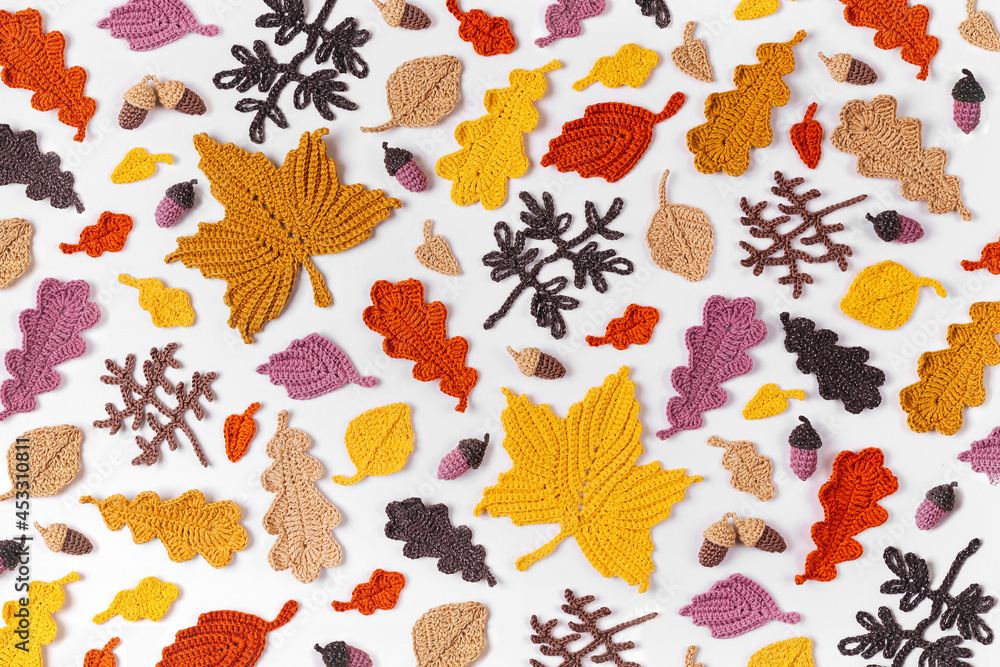 Pattern made of knitting yellow leaves. Autumn background. Fall mood Pattern made of knitting yellow leaves. Autumn background. Fall mood