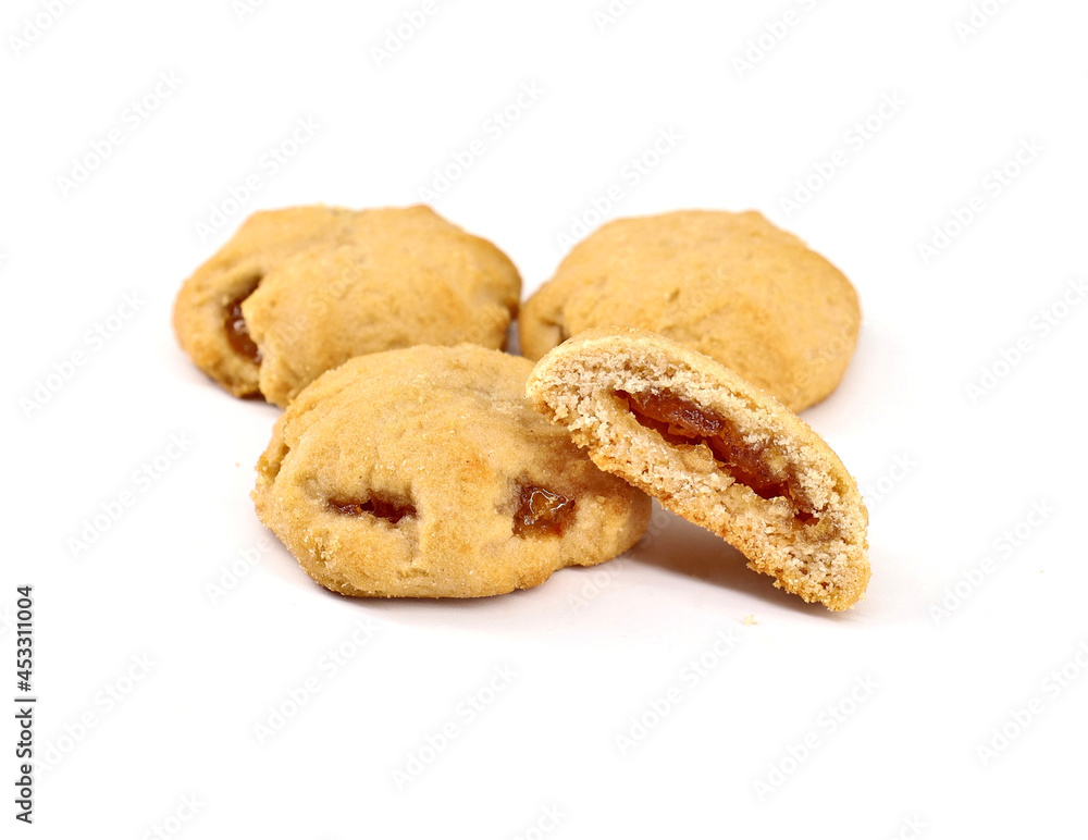 Shortbread cookies stuffed with jam on white background. Shortbread cookies stuffed with jam on white background.