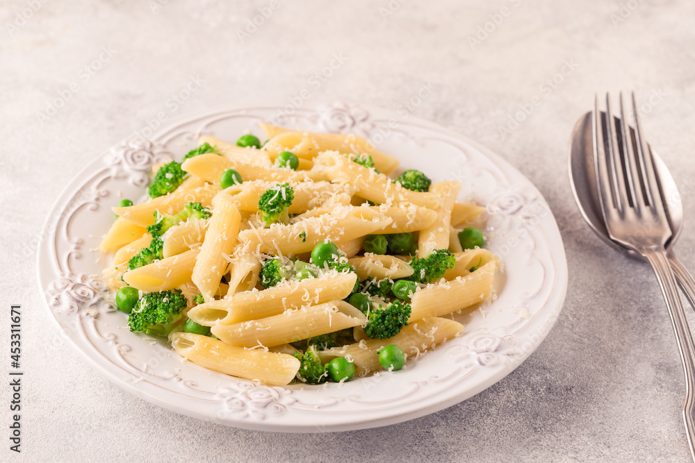 Pasta with green peas, broccoli and parmesan cheese. Pasta with green peas, broccoli and parmesan cheese.