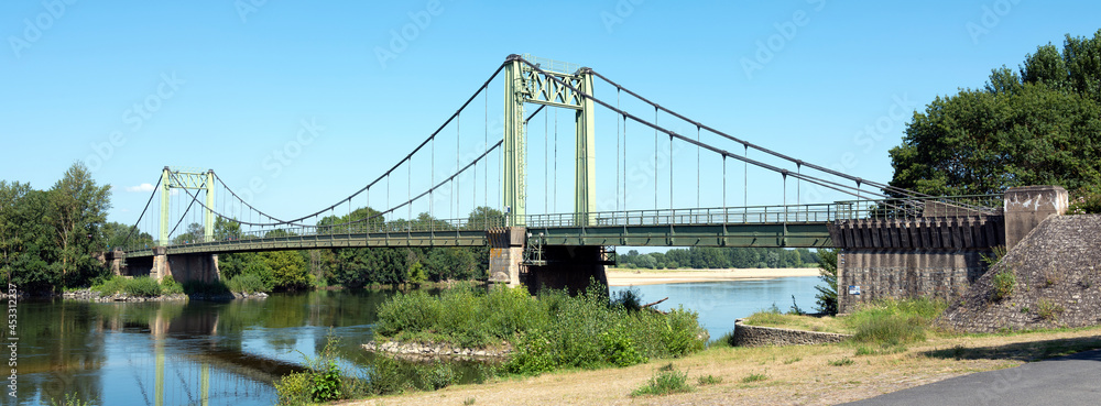 bridge over river loire in france between angers and tours in summer bridge over river loire in france between angers and tours in summer